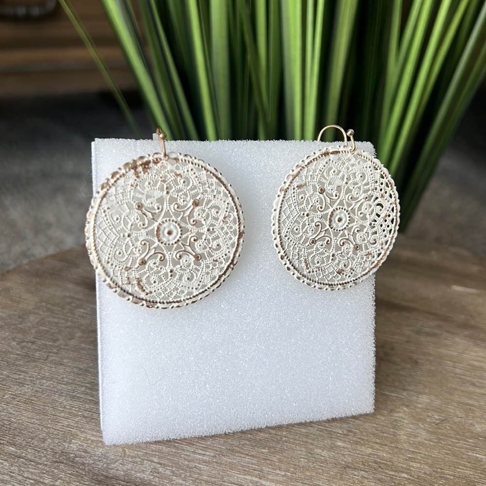 Gold and white detailed delicate earrings.